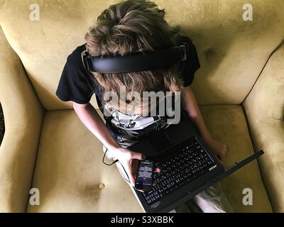 Teenager using technology at home Stock Photo
