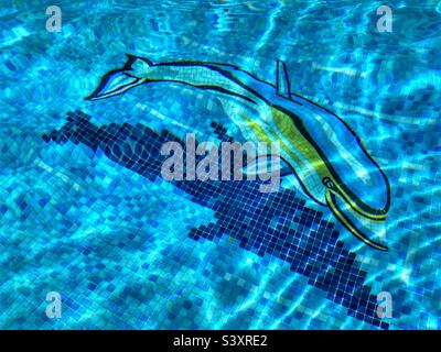 Dolphin mosaic in swimming pool Stock Photo