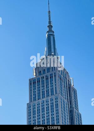 A close-up view of the tower on top of the Empire State building in New York City, USA Stock Photo