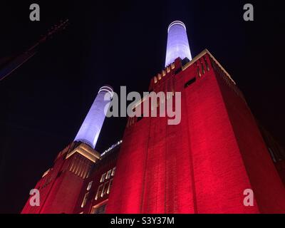 Battersea Power Station lit up red Stock Photo