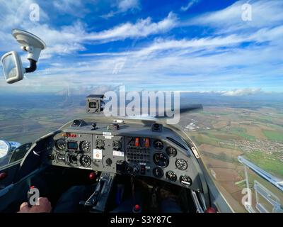 View from the cockpit of a Scheibe SF-25 Falke TurboFalke touring motor glider with instrument panel and view of the ground. SF25 Stock Photo