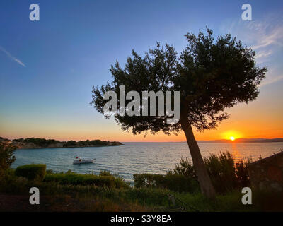 Sunset over Lardos Bay from Pefkos on island of Rhodes, Greece Stock Photo