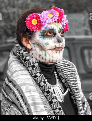 Day of the dead - woman with skull makeup and flowers Stock Photo