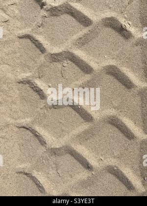 The pattern of a tire track in the sand Stock Photo