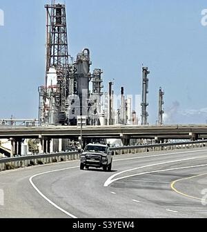 Traffic along the I-15 interstate freeway, passing near the industrial area between Bountiful and Salt Lake City, Utah, USA. This area has many working gas and oil refineries. Stock Photo