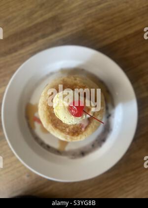 pancake, a scoop of vanilla ice cream and a cherry on top Stock Photo