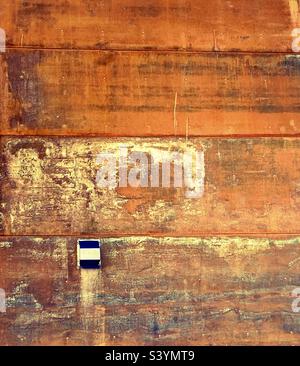 Rust covered steel exterior wall. Stock Photo