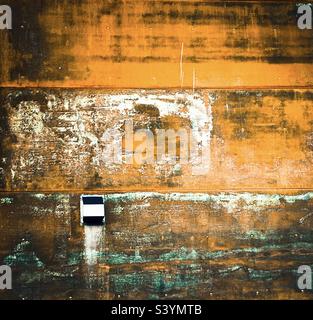Rust covered exterior wall. Stock Photo