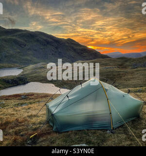 Wild Camping by Sprinkling Tarn, in the English Lake District, Cumbria, England. Stock Photo