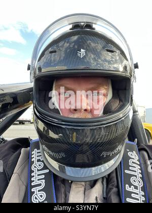 Race car driver in helmet Stock Photo