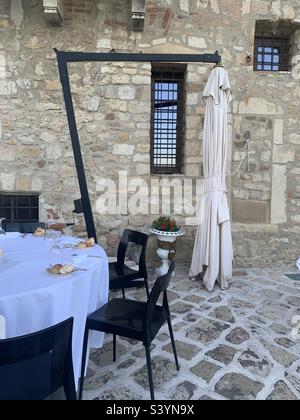 Restaurant in a medieval setting in Northern Italy Stock Photo