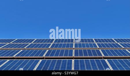 Solar panels against blue sky Stock Photo