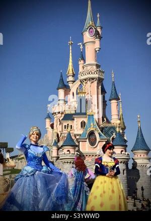 Cinderella and Snow White in front of Sleeping Beauty castle at Disneyland  Paris Stock Photo - Alamy