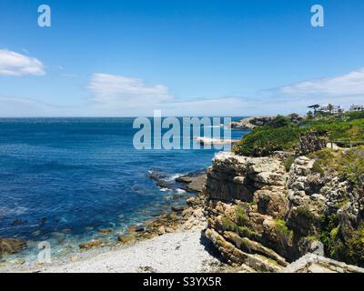Sea from cliff path with Gearing’s Point Hermanus in view Stock Photo