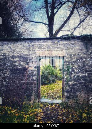 A photograph of an old walled garden gate Stock Photo