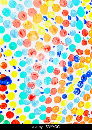Bright colorful polka dot background with; pink, red, orange, blue, yellow and green Stock Photo