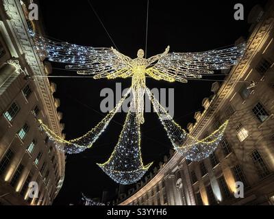 An angel or fairy? Christmas lights in London’s Regent Street closer view of one of the structures across the road Stock Photo