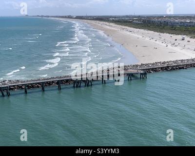 May, 2022, Pier and beach view from a cruise ship sailing out of Port Canaveral, Cape Canaveral, Brevard County, Florida, United States Stock Photo