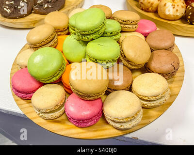 A plate of colourful macaroons for dessert at a party. Stock Photo