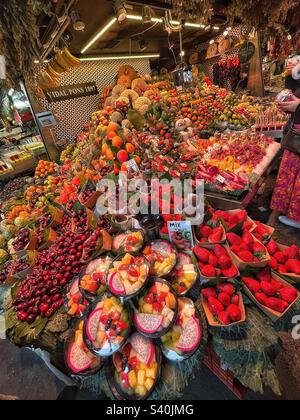 Assorted fruit colours of the rainbow displayed in Boqueria Market, La Rambla, Barcelona Stock Photo