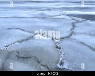 Ice floes cracked ice on the Baltic sea surface at the twilight Stock Photo