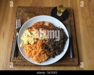 Haggis with Neeps and Tatties, mashed swede & carrots and mashed potatoes, traditional Burns Supper on 25th January. Pic1. Stock Photo