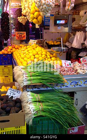 Valencia indoor market displaying an abundance of lovely fruit and vegetables. Waiting to be bought and weighed on the old fashioned weighing scales. Stock Photo