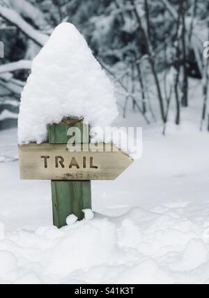 Trail sign in deep snow Stock Photo