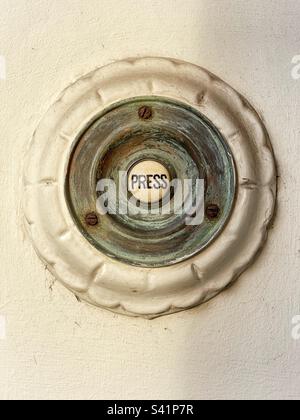 Victorian doorbell with press written in the centre Stock Photo