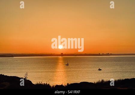 Sunrise over the ocean in Lagos Portugal Stock Photo
