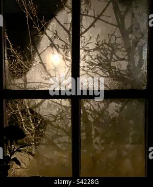 A view through frosted kitchen windows in winter. Stock Photo