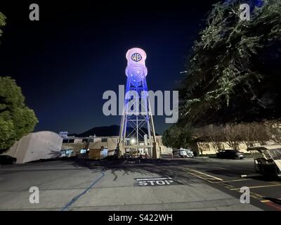 The iconic Warner Bros, Studios water tower illuminated at night, Burbank, California. Stock Photo