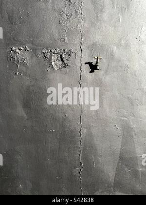 Water tap on cracked wall, Putney,London,U.K Stock Photo
