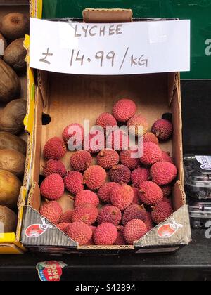 Lychee priced up for sale at local grocery Stock Photo