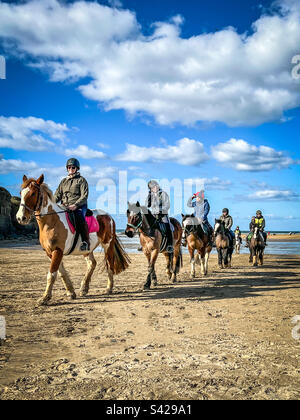 Horse riders on Perranporth Beach, Cornwall UK- February 26th 2023 Stock Photo