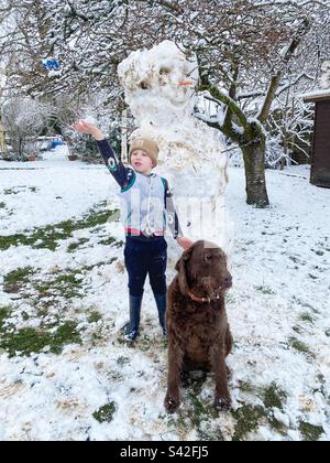 Six year old boy playing in the snow, Hampshire, England, United Kingdom. Stock Photo