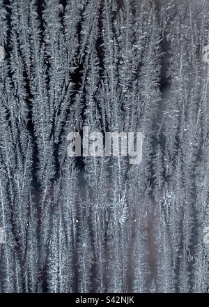 Streaks of frost on a window Stock Photo
