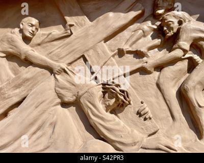 Jesus falls, Stations of the cross, 3rd, 7th, 9th Station, Via Dolorosa, portrait mode, nearly life sized cast relief, Canaan in the Desert, Phoenix, Arizona Stock Photo