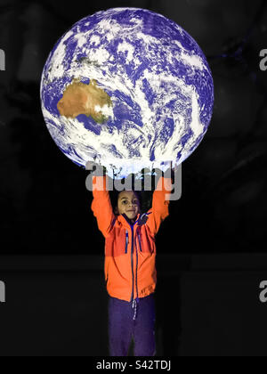 Boy holding the whole World in his hands Stock Photo