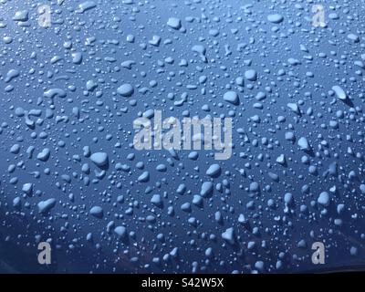 Waterdrops on blue surface Stock Photo