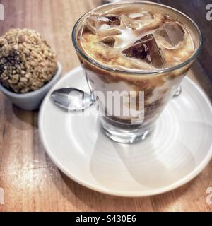 Ice cold latte with energy ball for the summer - Melbourne, Australia Stock Photo