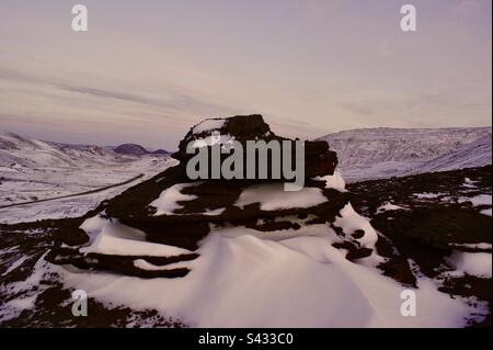 Wild desolate unforgiving frozen landscape of the Icelandic tundra near Reykjavik, Iceland in winter Stock Photo