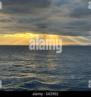 Sun behind clouds over the Gulf of Mexico viewed from a cruise ship Stock Photo