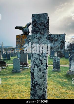 Grave stone in form of a cross in Cromdale churchyard, Scotland Stock Photo