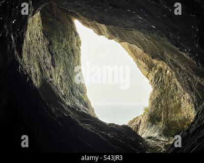 View from inside Paviland cave, Gower peninsula, Swansea, South West Wales. Stock Photo