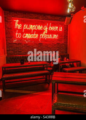 The purpose of beer is to create pleasure neon sign in Salt bar in Leeds City Centre Stock Photo