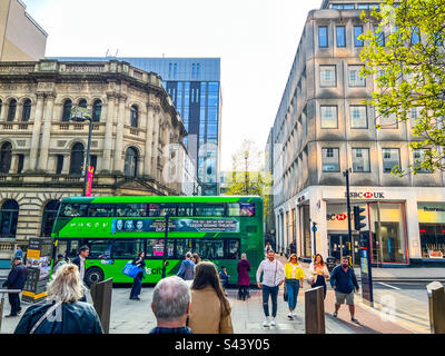 Green bus on Park Row in Leeds city centre Stock Photo