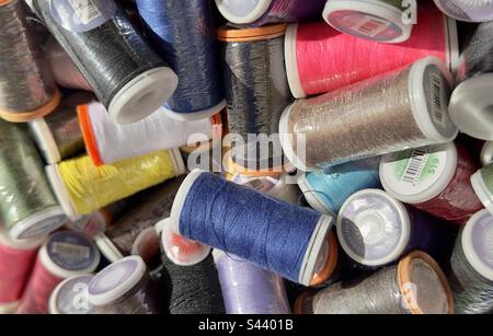 An assortment of coloured reels of cotton on sale in a French Street market Stock Photo