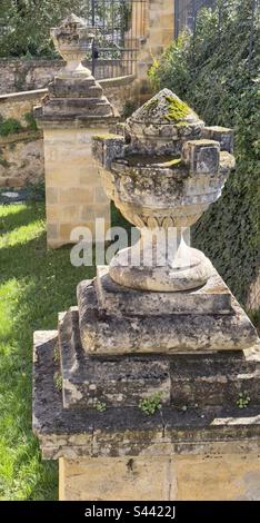 Two stone vases in the garden of a French hotel. Stock Photo