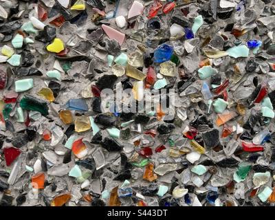 small colorful glass shards on a gray surface Stock Photo